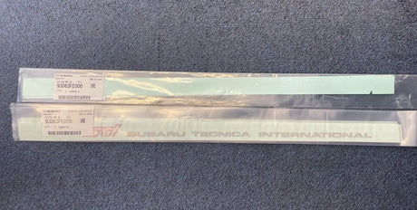 93063FE000 & 93063FE020 Subaru STI Front Door Sill Emblem RH & LH 2004