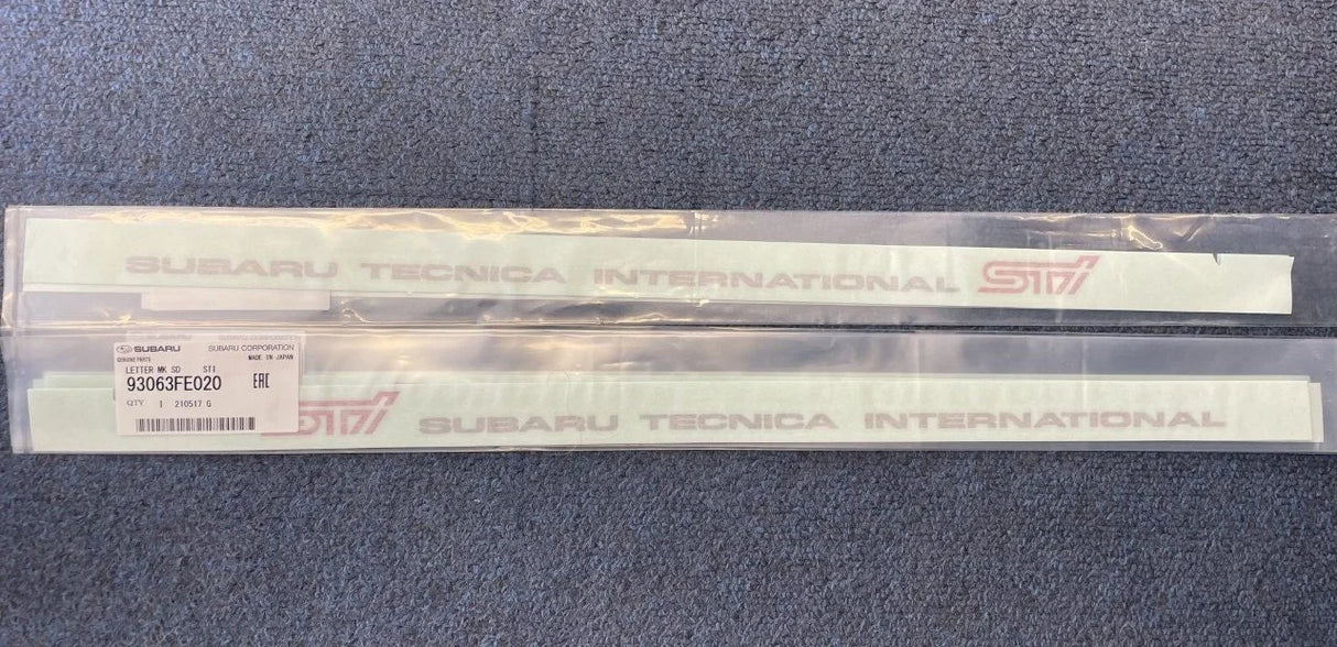 93063FE000 & 93063FE020 Subaru STI Front Door Sill Emblem RH & LH 2004